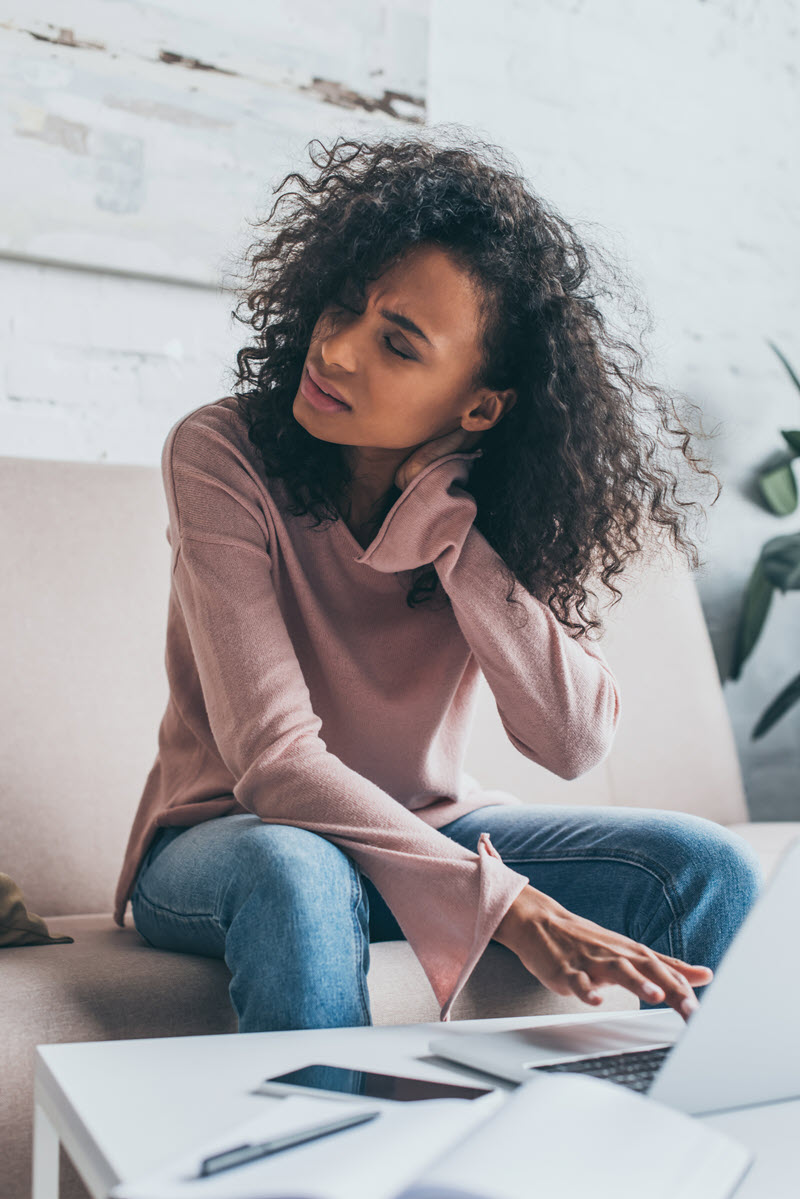tired woman working sore neck