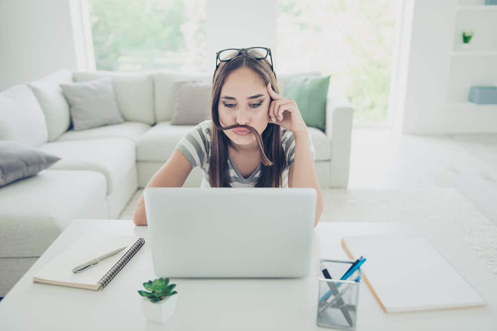 woman with moustache hair laptop