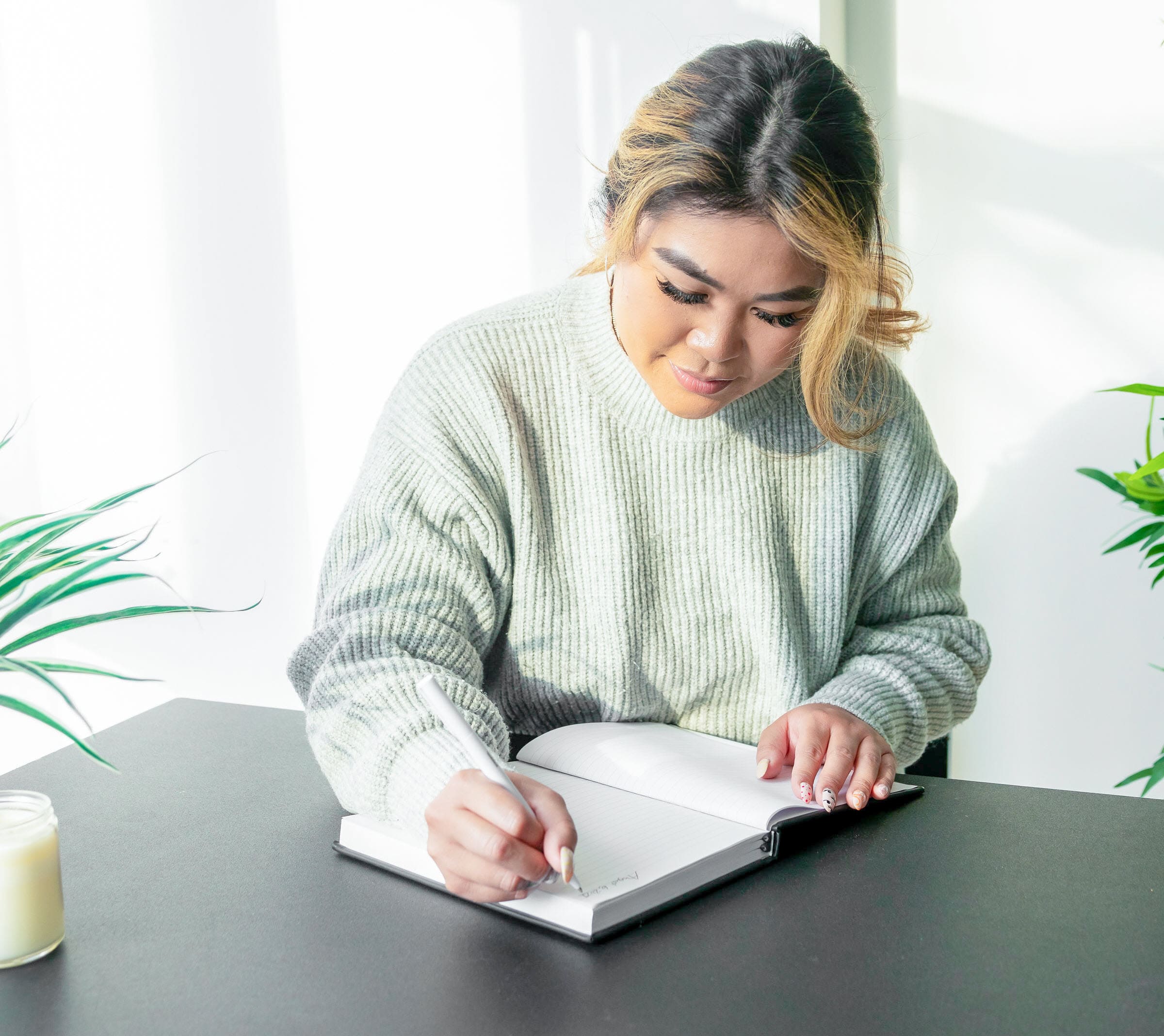 woman writing in journal